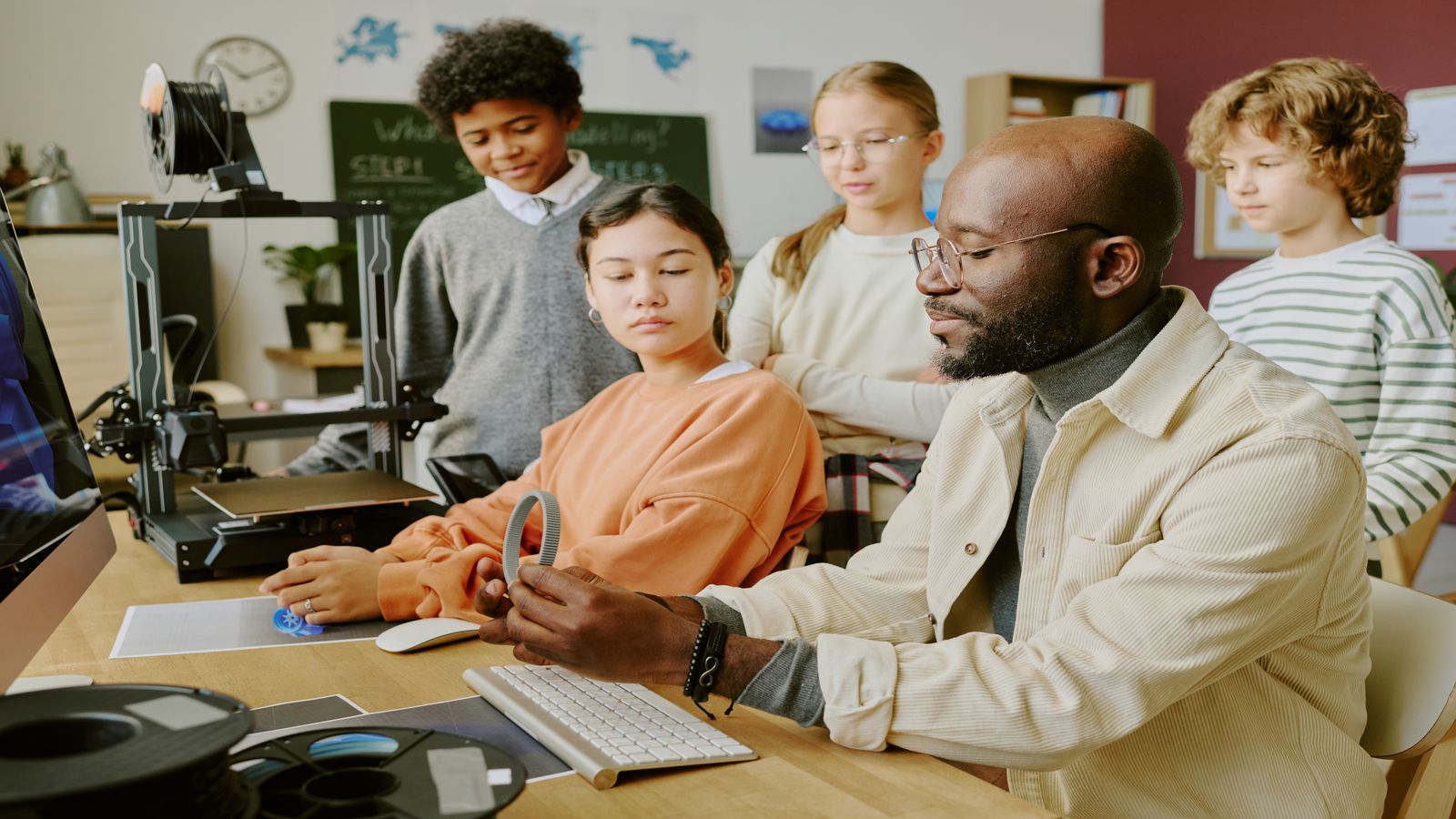 Students working together on a computer science activity in a classroom